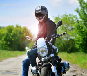 motorcycle rider sitting on his bike wearing a helmet
