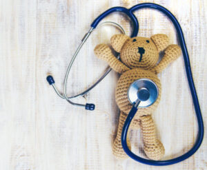 stuffed bear with stethoscope on it