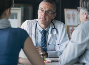 doctor talking to family