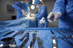 surgery with surgeon and surgical techs